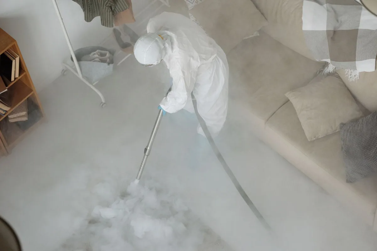 Biohazard cleanup technician in protective equipment, Ardmore, PA